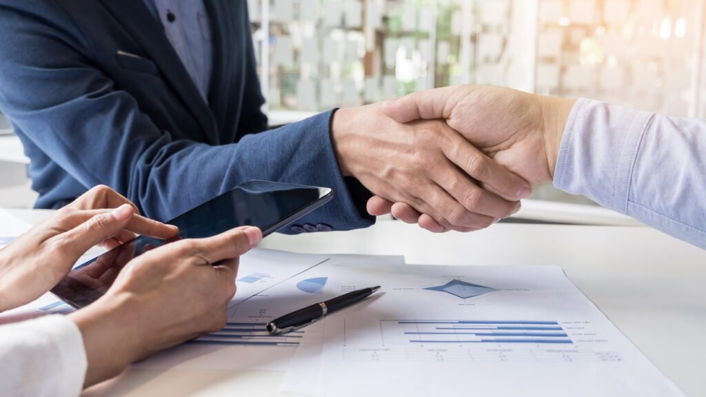 Business handshake of two men demonstrating their agreement to s
